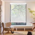 faux wood blinds in white with adjustable slats for light control and privacy.