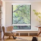 faux wood blinds in white with adjustable slats for light control and privacy.